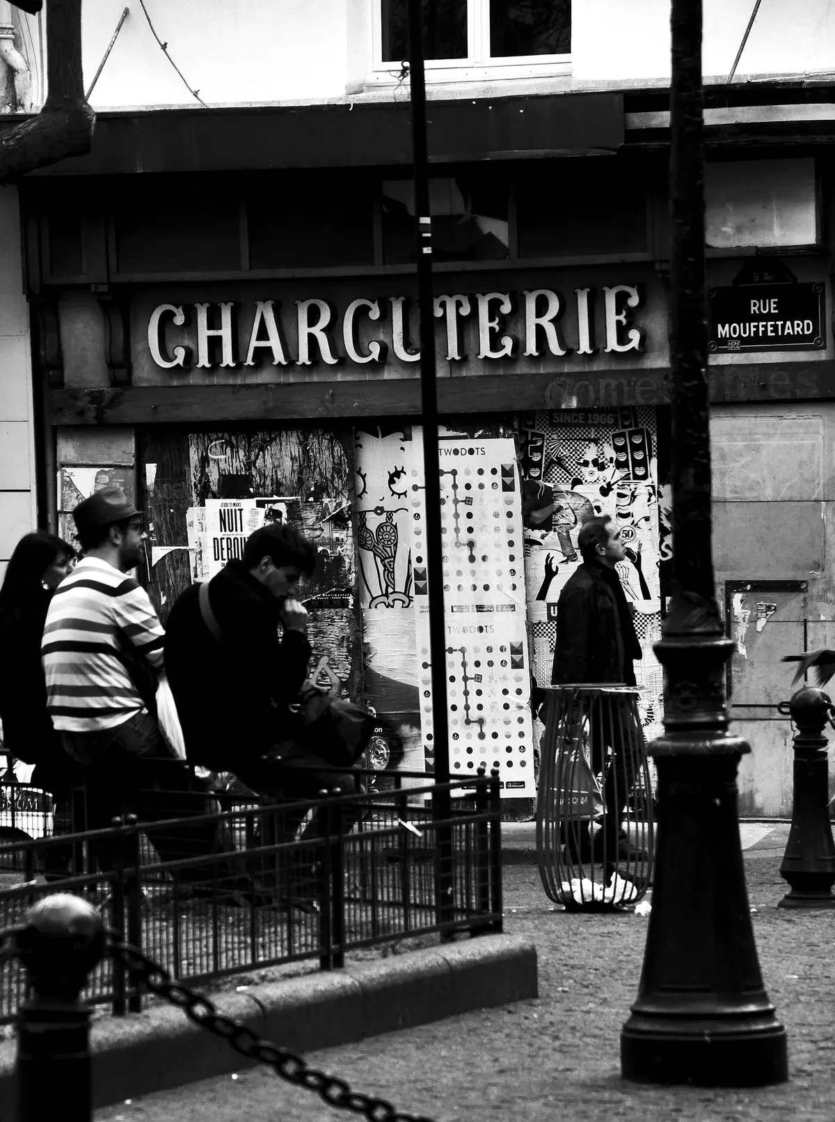 A charcuterie display of hams and sausages on Rue Mouffetard in Paris